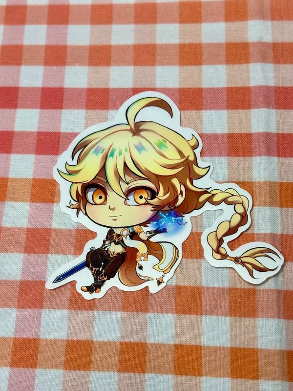 Close up of chibi sticker of Genshin Impact's Aether. 