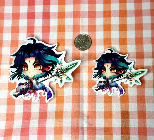 Comparison of chibi Xiao sticker, large and small, compared to a quarter.
