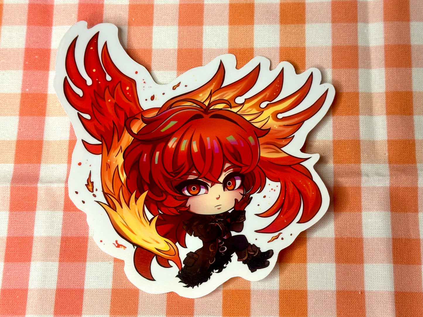 Close up of chibi sticker of Genshin Impact's Diluc. 