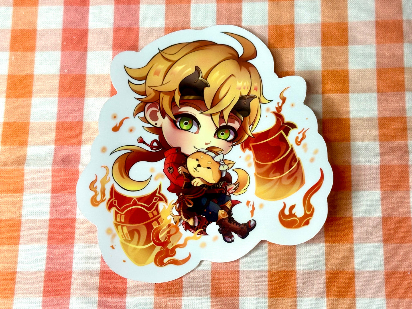 Close up of chibi sticker of Genshin Impact's Thoma. 