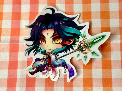Close up of chibi sticker of Genshin Impact's Xiao. 